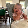 baby, high_chair, smile, hand, indoor, kitchen, table, chair, window, blinds, person, furniture, happy, child, face, infant, cute, home, feeding, playful