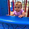 toddler, child, playground, play_equipment, blue, red, outdoor, daylight, person, clothing, short_sleeve, face, hands, expression, sky, fun, recreation, young_child, cute, curious