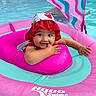 Shiloh joined the competition — help win amazing prizes! baby, pool, float, swim_school, hat, water, child, pink, aqua, sun_hat, infant, summer, outdoor, cute, sitting, playful, swimming, canopy, happy, portrait