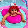 baby, child, pool, water, swimming, float, inflatable, hat, red, pink, turquoise, splashing, summer, outdoor, happy, smiling, face, arm, play, cute