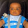 Aylan participe au concours pour gagner de l'argent avec cette photo : baby, blue_clothing, car_seat, casual_wear, child, closeup, curly_hair, cute, expression, indoor, infant, looking_away, pacifier, person, portrait, safety, seatbelt, straps, toddler, young_child