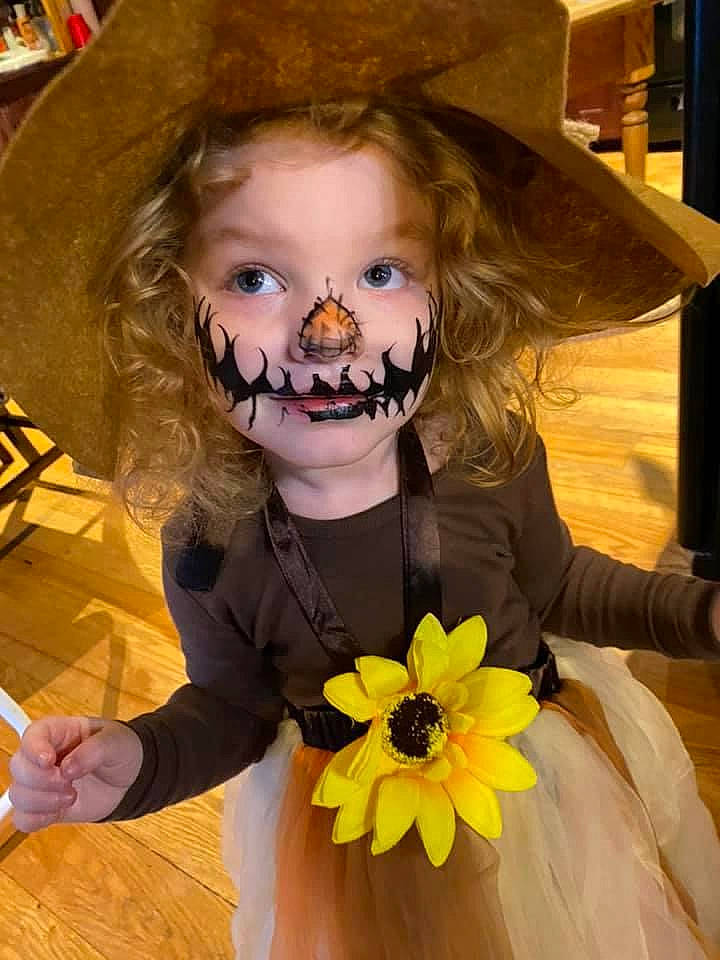 Jayleigh is registered to the contest to win money with this photo: beard, chair, child, costume_hat, eyewear, facial_expression, facial_hair, fashion_accessory, flower, fun, hairstyle, happy, hat, headgear, human, jewellery, organ, person, petal, sun_hat