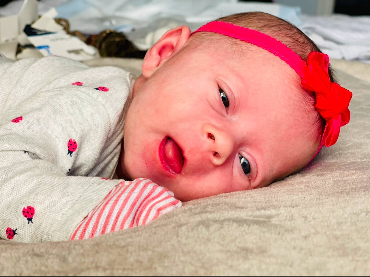 Oaklynn is registered to the contest to win money with this photo: baby, baby_toddler_clothing, bedtime, carmine, cheek, child, close_up, comfort, fun, grass, happy, linens, lip, person, portrait_photography, sleep, toddler, winter