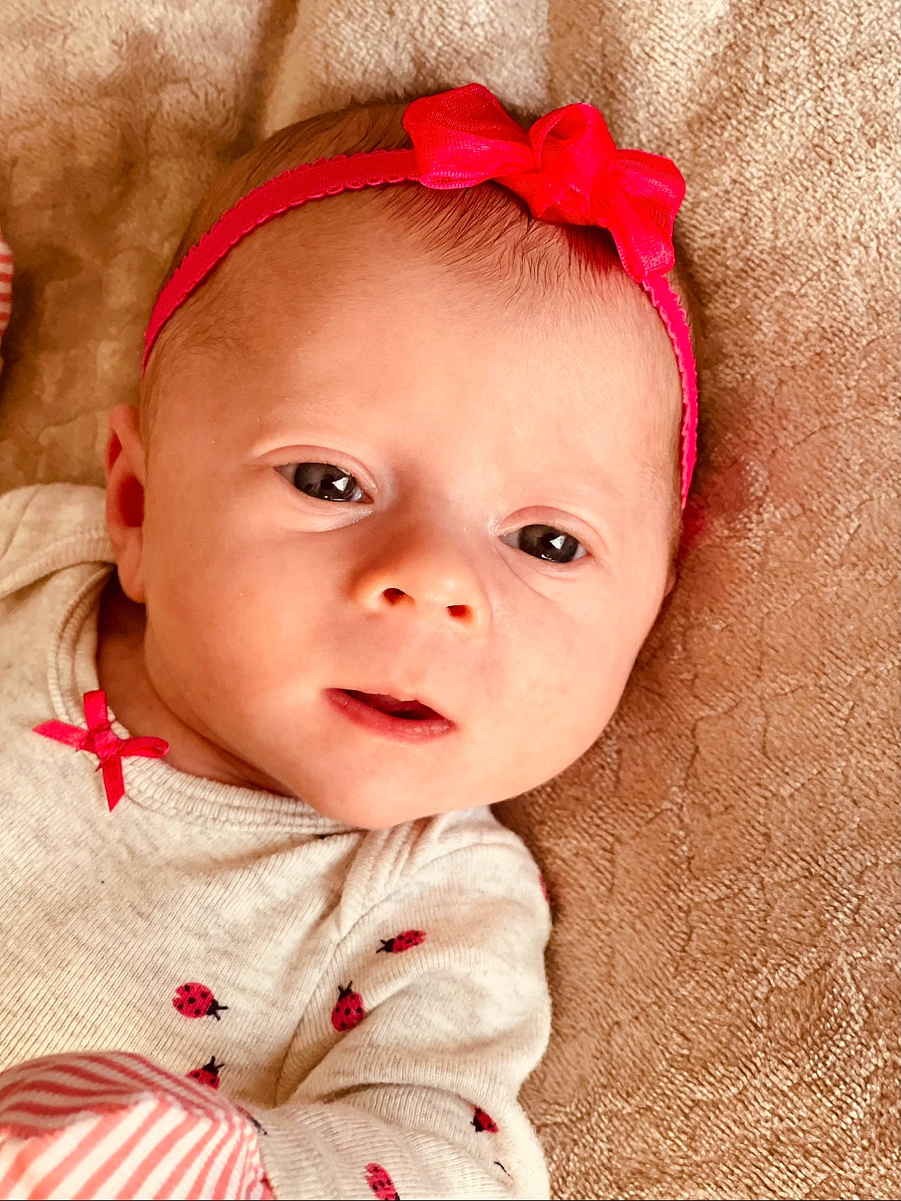 Oaklynn is registered to the contest to win money with this photo: baby, baby_toddler_clothing, cheek, chin, collar, eye, eyelash, face, happy, head, iris, lip, nose, outerwear, person, pink, red, skin, sleeve, textile
