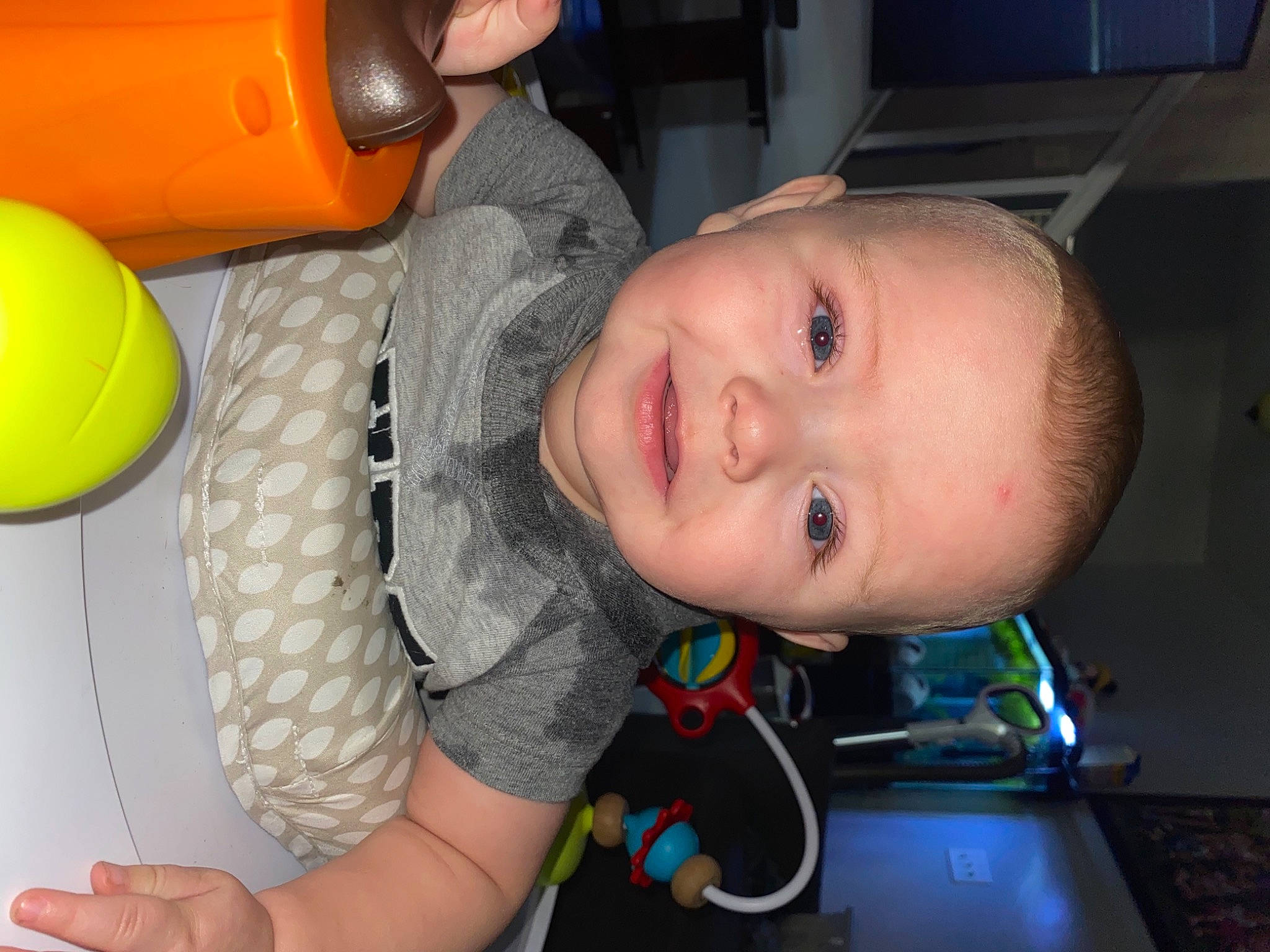 Weston is registered to the contest to win money with this photo: arm, baby, balloon, cheek, child, eye, face, facial_expression, fun, happy, head, iris, joy, mouth, nose, organ, person, skin, smile, snapshot