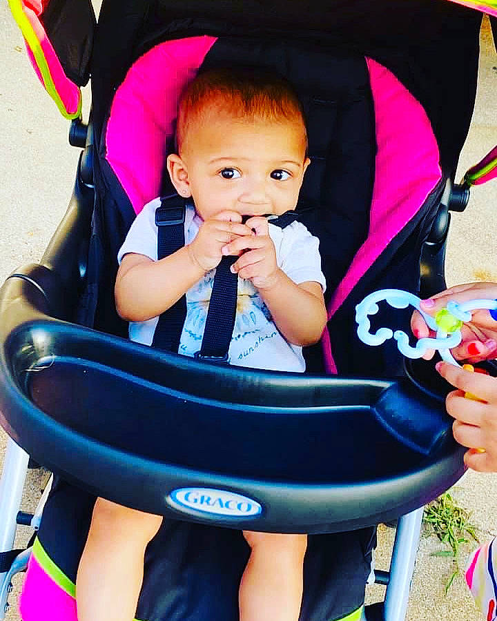 Arizona is registered to the contest to win money with this photo: baby, baby_carriage, baby_products, baby_safety, baby_toddler_clothing, chair, child, comfort, electric_blue, fashion_accessory, fun, happy, human_leg, lap, leisure, person, photograph, sitting, toddler, vacation