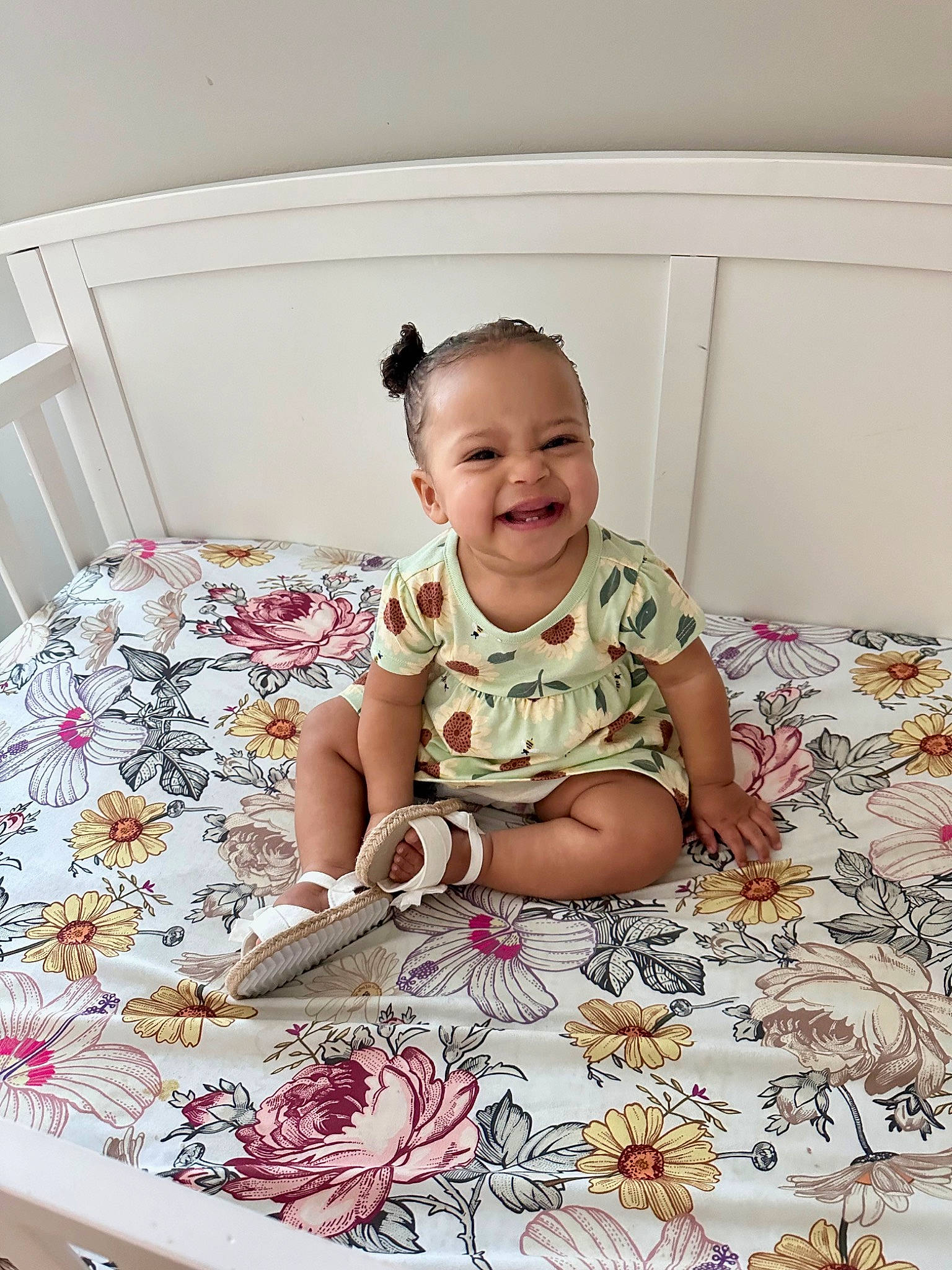 Meadow is registered to the contest to win money with this photo: baby_toddler_clothing, child, clothing, comfort, dress, facial_expression, floor, flooring, fun, hairstyle, happy, joy, linens, magenta, pattern, person, pink, sitting, sleeve, smile
