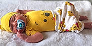 Lucas participe au concours pour gagner de l'argent avec cette photo : newborn, baby, sleeping, pacifier, yellow_clothing, hat, blanket, winnie_the_pooh, infant, cute, cozy, soft, resting, child, pajamas, smiling_face_print, hand, foot, indoors, portrait