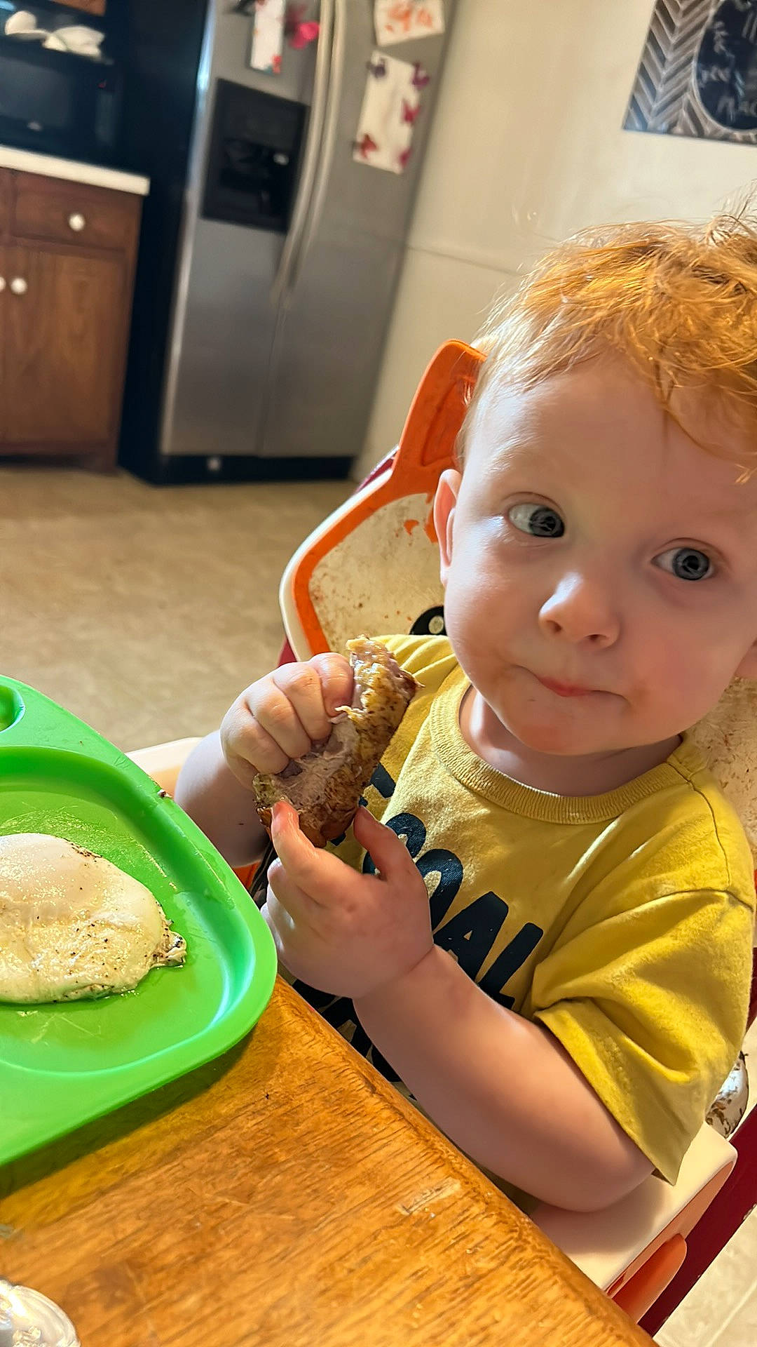 Jasper is registered to the contest to win money with this photo: baby_toddler_clothing, cabinetry, chair, chest_of_drawers, child, comfort_food, cooking, cupboard, drawer, food, food_craving, fun, ingredient, kitchen_appliance, person, plate, play, recipe, table, tableware