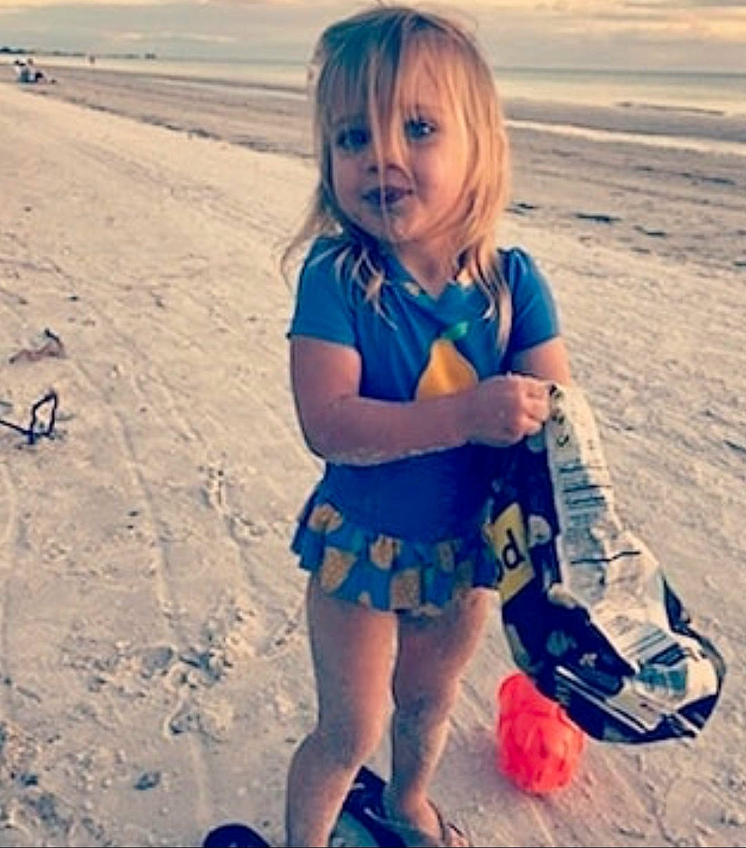 Audrey joined the competition — help win amazing prizes! azure, beach, beauty, body_of_water, clothing, cloud, cool, eye, hair, happy, morning, natural_environment, people_in_nature, person, sand, sleeve, summer, t_shirt, toddler, travel