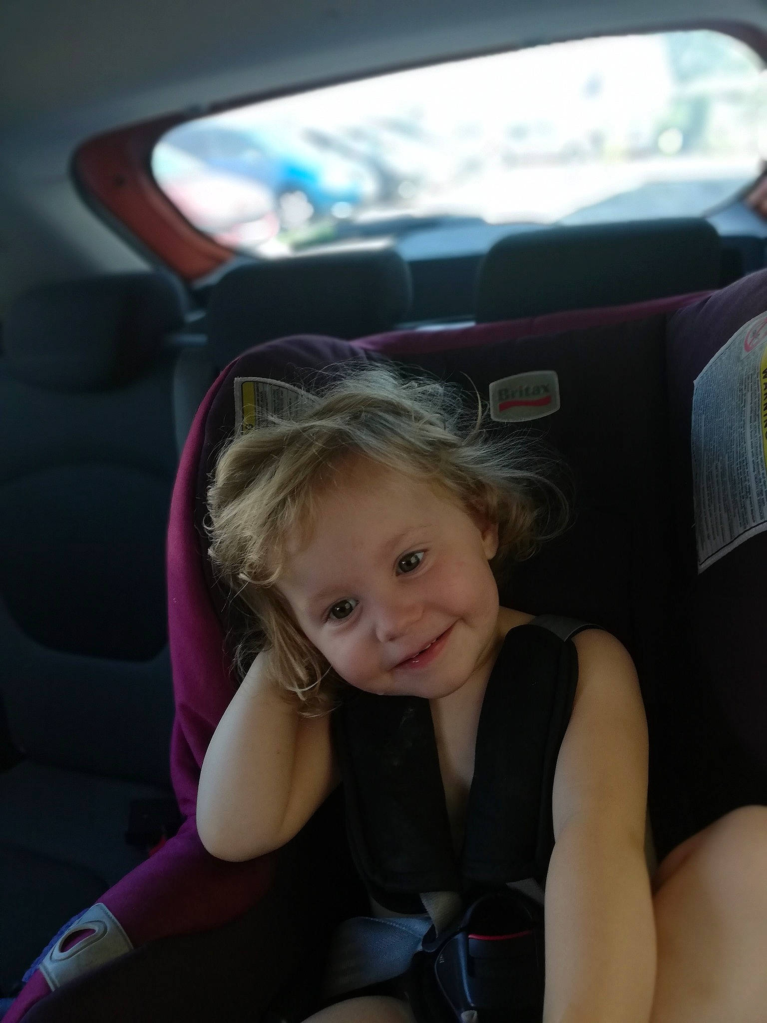 Kara a rejoint le concours — aidez-le/la à gagner de superbes lots ! auto_part, blond, car, car_seat, child, driving, family_car, fun, hair, head_restraint, joy, luxury_vehicle, person, sitting, skin, smile, steering_wheel, technology, toddler, vacation