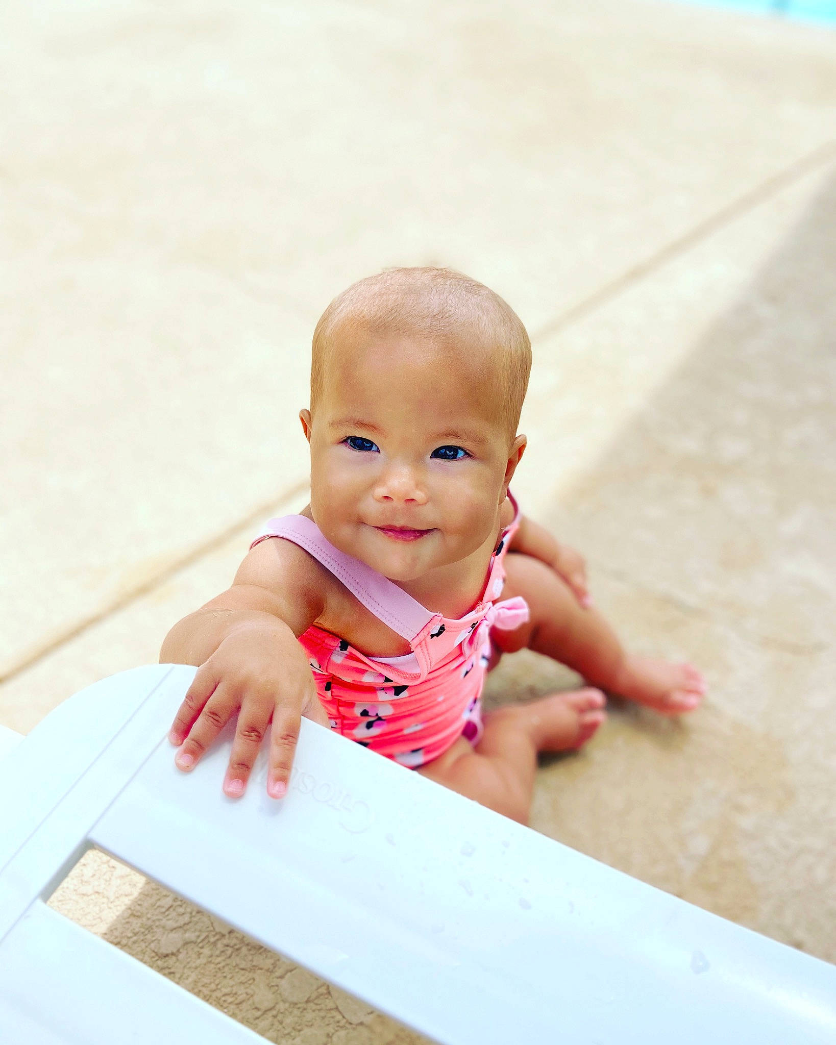 Milarose is registered to the contest to win money with this photo: baby, child, crawling, finger, floor, flooring, fun, hand, joy, person, photography, pink, play, product, room, sitting, skin, smile, table, toddler
