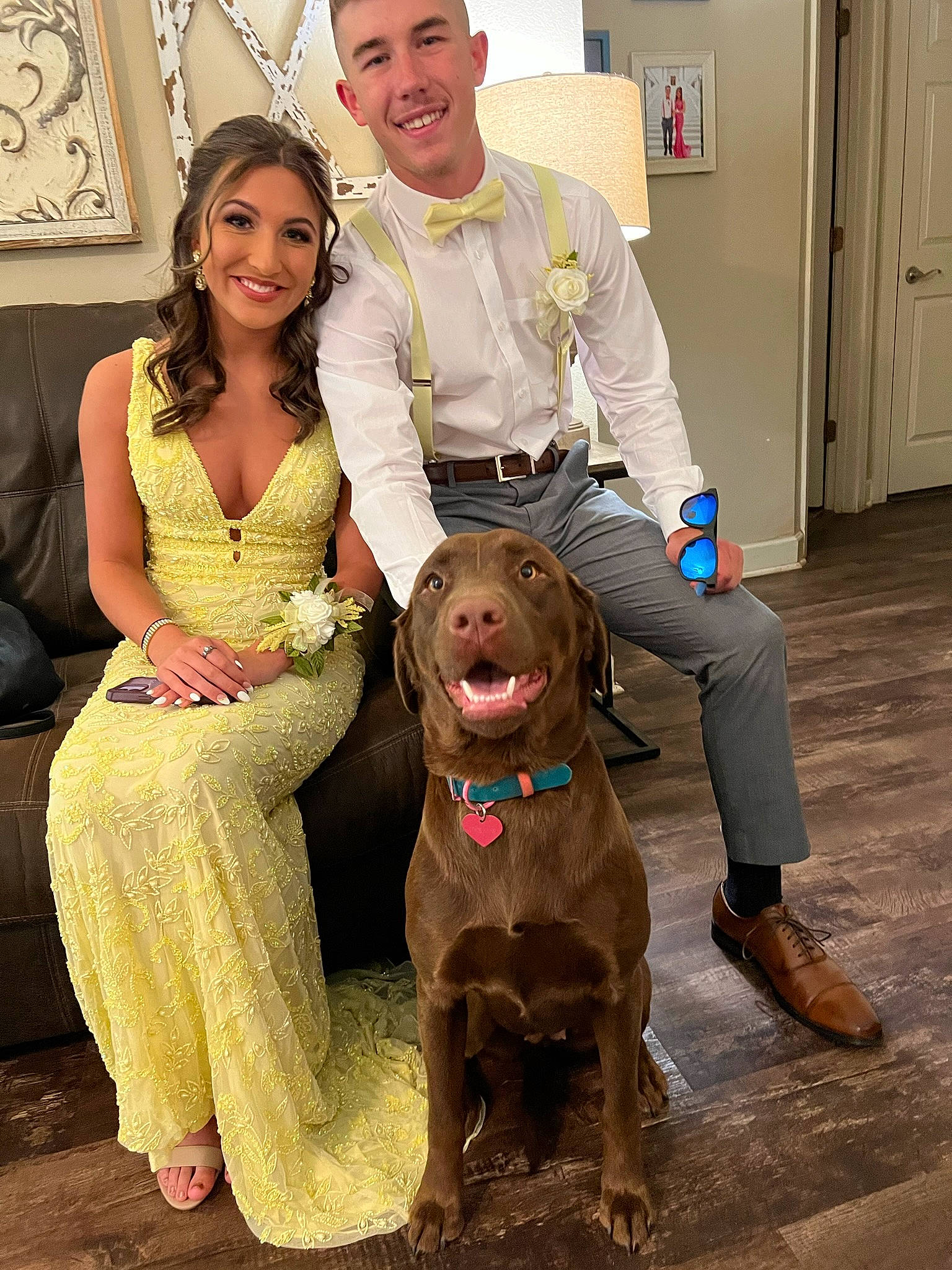 Dixie Mae is registered to the contest to win money with this photo: carnivore, companion_dog, dog, dog_breed, door, dress, event, eyewear, face, fashion_design, fawn, fun, happy, hat, leg, people, picture_frame, smile, standing, sunglasses