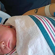 Berkley joined the competition — help win amazing prizes! baby, bed, care, closeup, comfort, hand, hat, hospital_bed, hospital_blanket, indoor, infant, newborn, parent, patient_wristband, person, resting, skin, sleeping, striped_blanket, tattoo