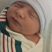 Berkley is registered to the contest to win money with this photo: newborn, baby, sleeping, blanket, beanie, infant, wrapped, hospital, cute, face, child, soft, peaceful, portrait, closeup, skin, headwear, resting, comfort, indoors