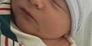Berkley is registered to the contest to win money with this photo: baby, beanie, blanket, child, closeup, comfort, cute, face, headwear, hospital, indoors, infant, newborn, peaceful, portrait, resting, skin, sleeping, soft, wrapped