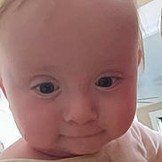 Bellamy joined the competition — help win amazing prizes! baby, close_up, face, child, curious, hair, indoor, infant, person, portrait, shirt, stain, wide_eyes, young, head, skin, expression, cute, cheeks, lighting