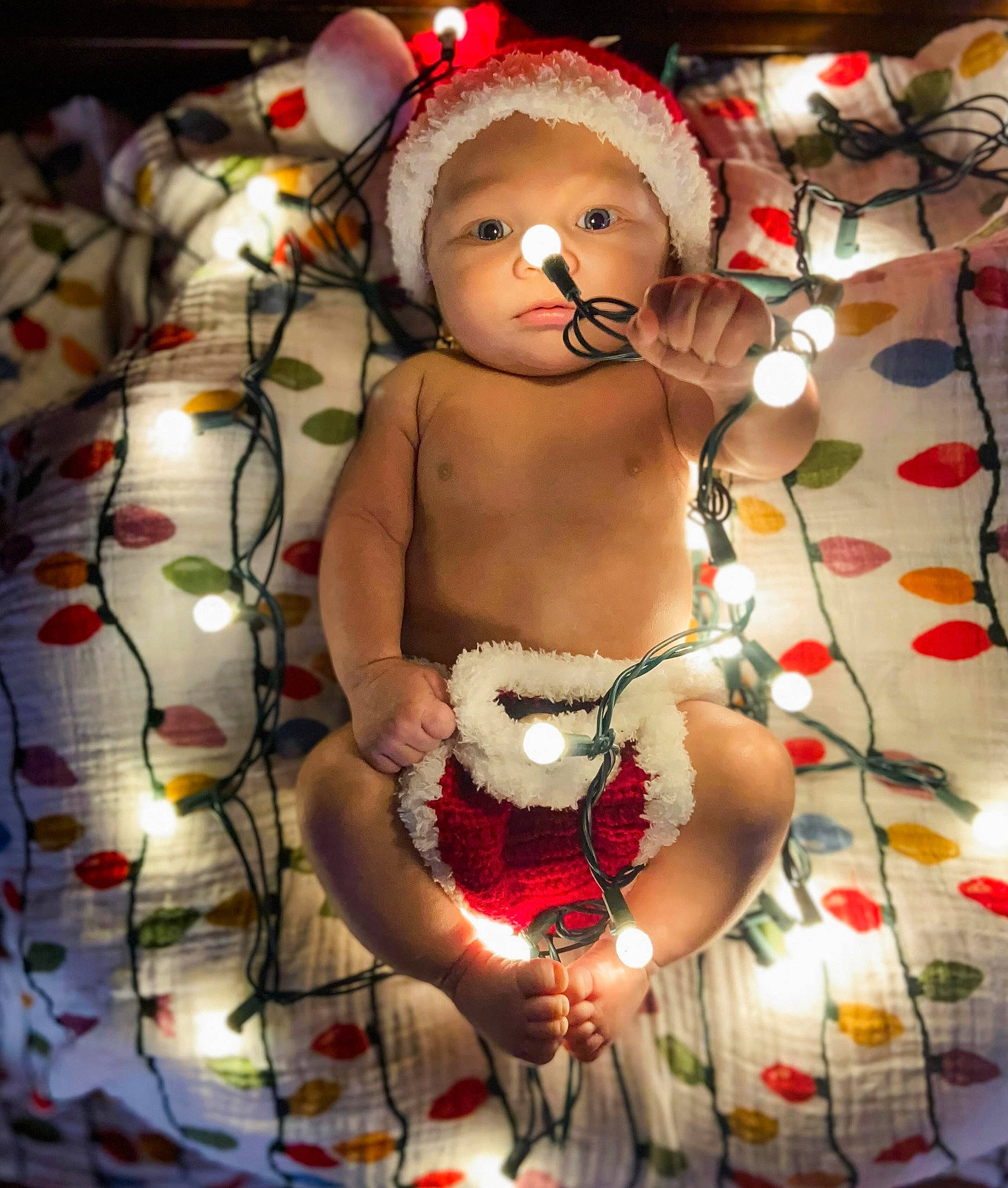 Braison is registered to the contest to win money with this photo: abdomen, baby, carmine, cheek, chest, child, christmas, christmas_ornament, event, eye, hand, happy, jewellery, navel, person, textile, toddler, toy, tradition, trunk