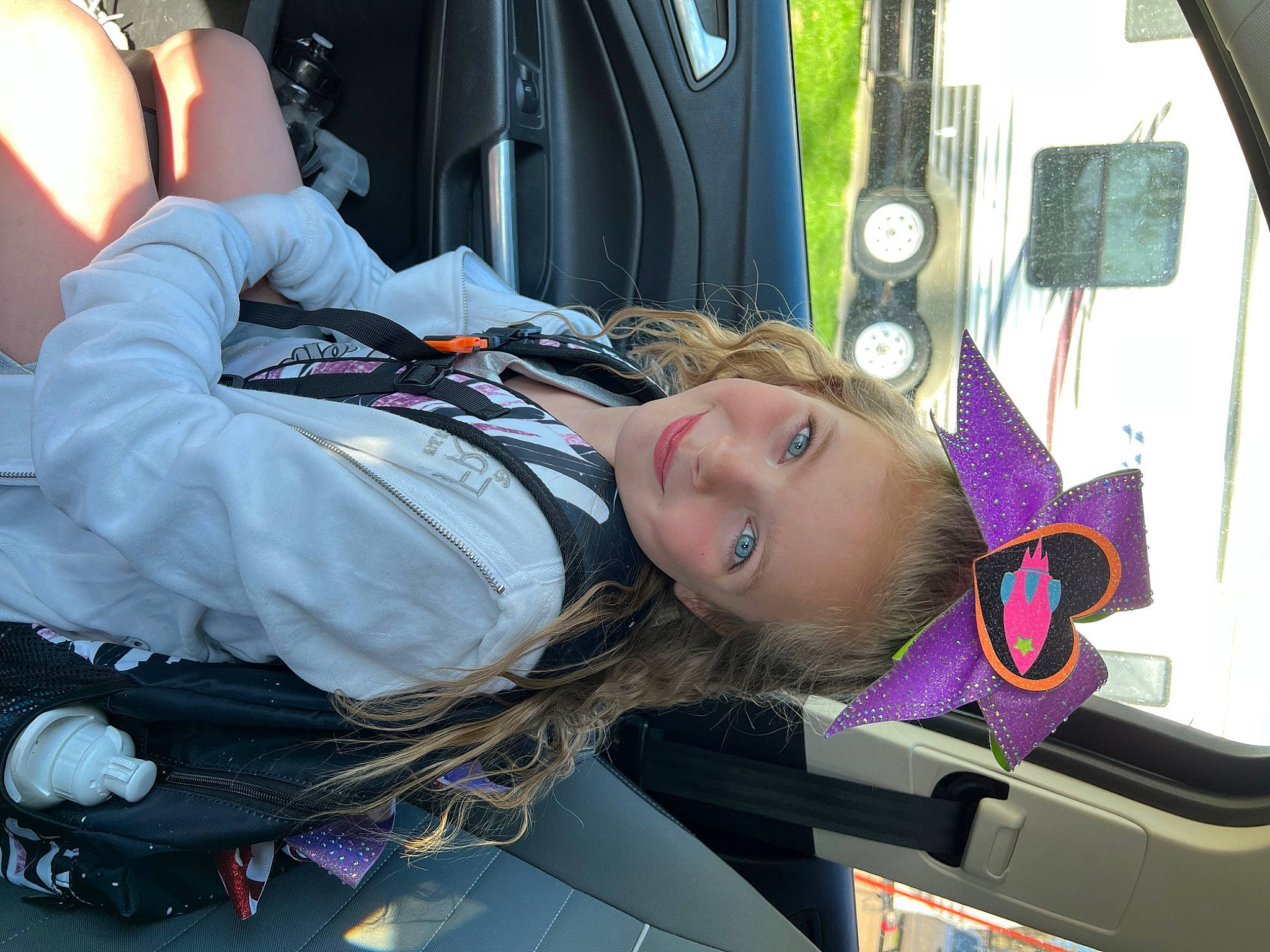 Delanie is registered to the contest to win money with this photo: auto_part, automotive_design, automotive_exterior, automotive_lighting, automotive_tire, automotive_wheel_system, automotive_window_part, car, car_seat, child, family_car, fun, joy, luxury_vehicle, motor_vehicle, passenger, person, rim, tree, trunk