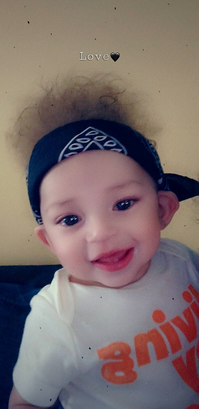 Tray is registered to the contest to win money with this photo: baby, baby_toddler_clothing, cap, cheek, chin, eyebrow, eyelash, face, forehead, happy, headwear, iris, joy, lip, mouth, nose, person, pink, skin, sleeve