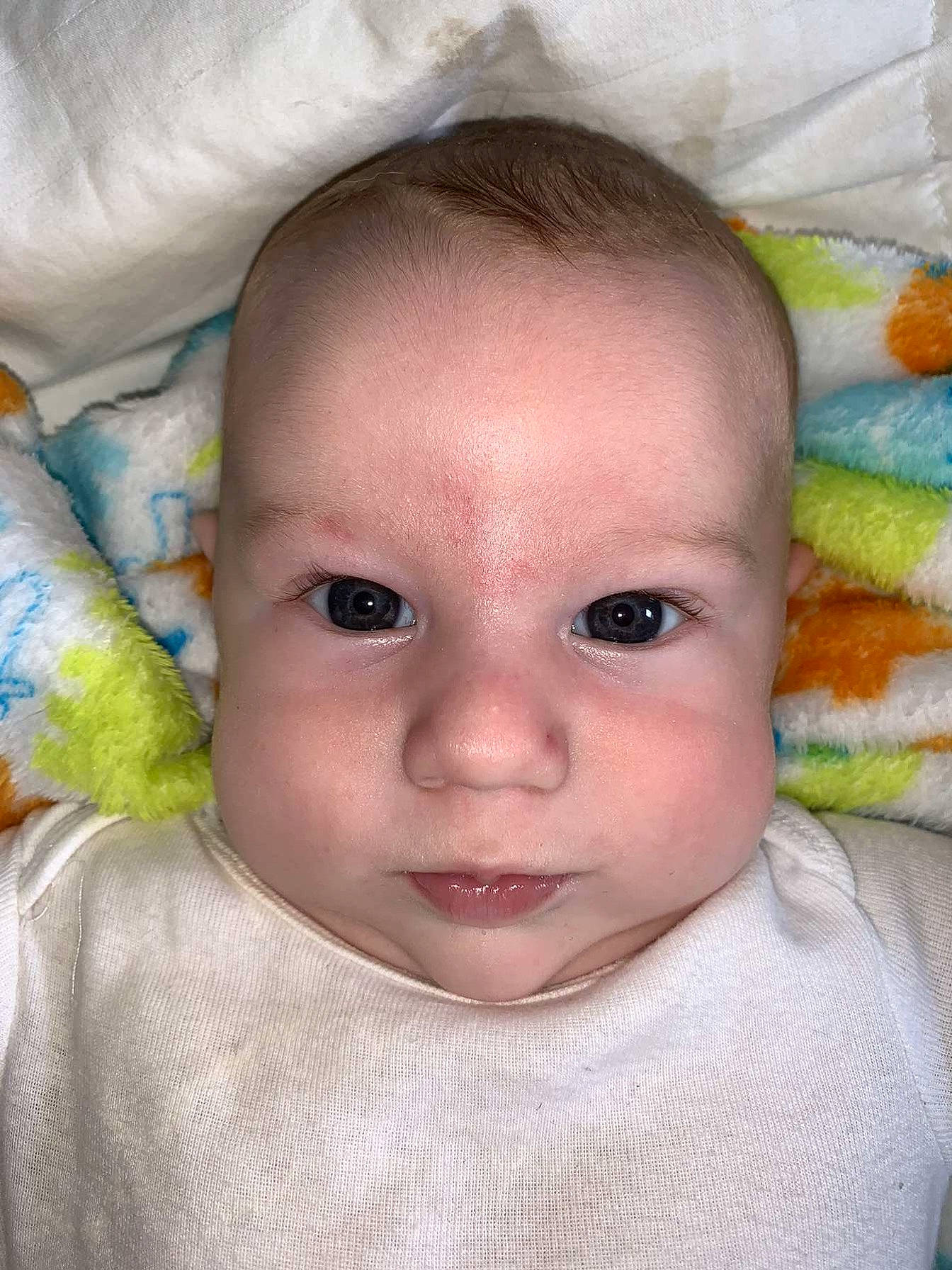 Nash is registered to the contest to win money with this photo: baby, baby_making_funny_faces, cheek, child, chin, close_up, ear, eye, eyebrow, face, forehead, head, iris, linens, lip, mouth, nose, person, skin, smile
