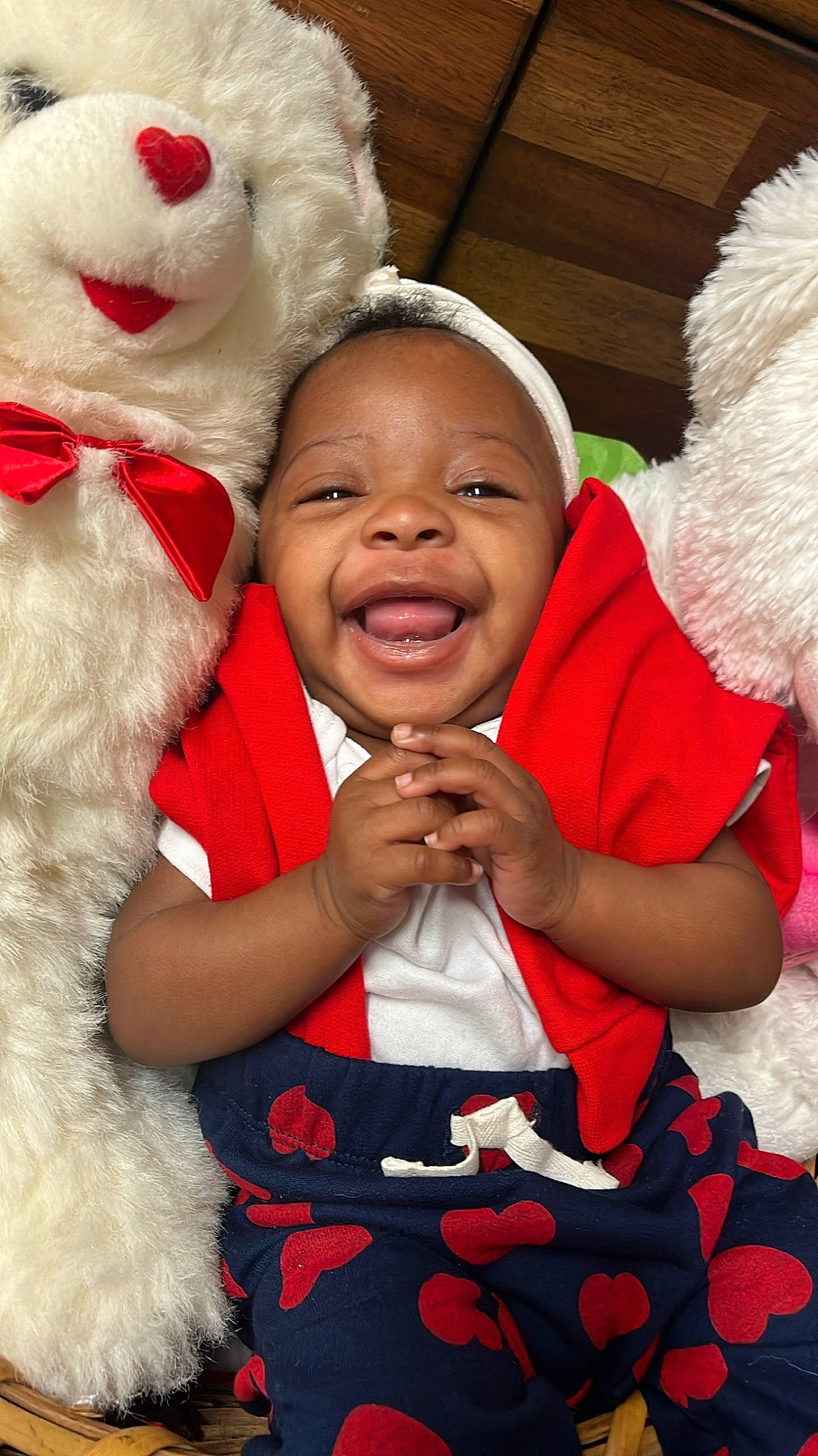 Forever Murray is registered to the contest to win money with this photo: child, event, facial_expression, finger, fun, gesture, hand, happy, head, interaction, mammal, nose, organ, person, pink, red, skin, smile, textile, toddler