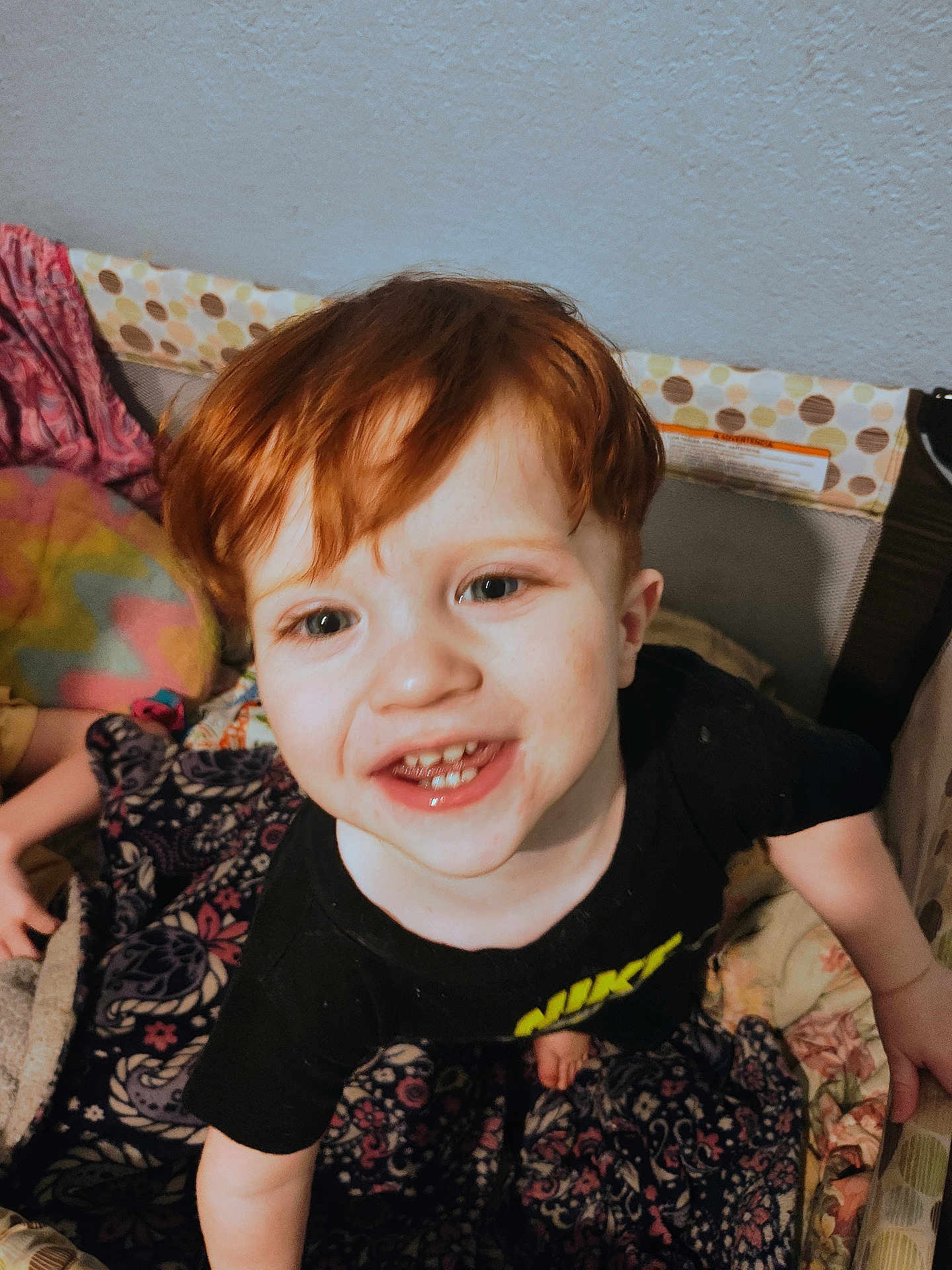 Alexander joined the competition — help win amazing prizes! child, toddler, smiling, red_hair, indoor, blanket, playpen, face, person, happy, clothing, patterned_blanket, baby, cute, young_child, portrait, furniture, hand, head, skin