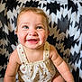 baby, smiling, child, infant, cute, happy, sitting, blanket, pattern, clothing, face, portrait, indoors, skin, person, baby_girl, bright_eyes, cheerful, soft_texture, ladybug_print