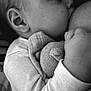 Soan participe au concours pour gagner de l'argent avec cette photo : baby, infant, breastfeeding, black_and_white, close_up, sleeping, plush_toy, soft_texture, hand, face, ear, clothing, peaceful, comfort, tenderness, portrait, young_child, monochrome, cuddling, rest