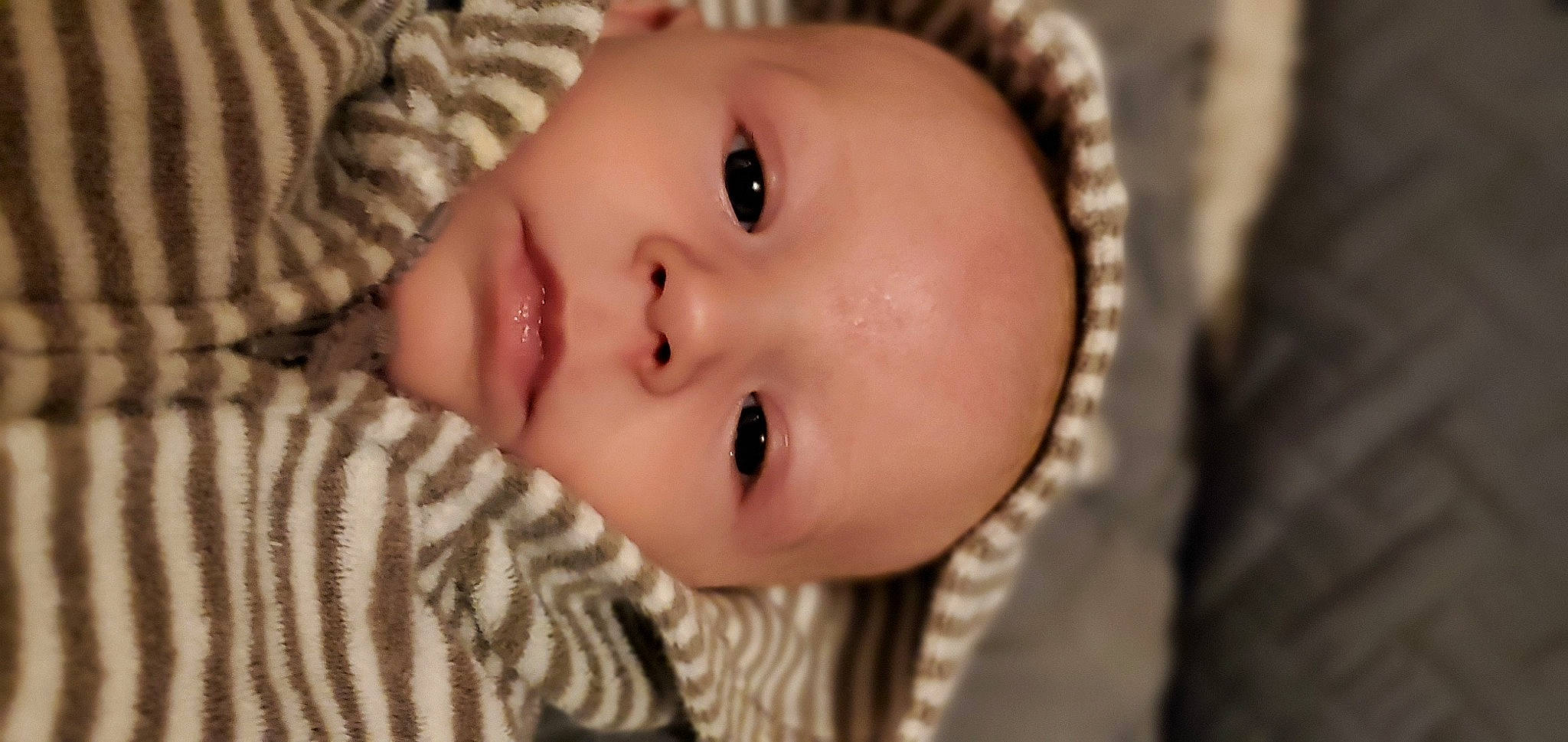 Kye is registered to the contest to win money with this photo: baby, baby_toddler_clothing, cheek, clothing, eye, eyelash, fashion_accessory, flash_photography, fur, grass, happy, iris, lip, nose, pattern, person, skin, sleeve, smile, toddler