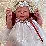Blakely is registered to the contest to win money with this photo: accessories, baby, bodypart, bonnet, clothing, costume, diamond, dress, face, finger, formalwear, gemstone, hand, hat, head, jewelry, newborn, person, photography, portrait