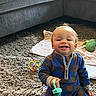 Levi is registered to the contest to win money with this photo: toddler, child, carpet, toy, blanket, couch, indoor, smiling, playtime, clothing, person, furniture, happy, kneeling, plush_toy, casual_wear, home, cute, baby, young_child