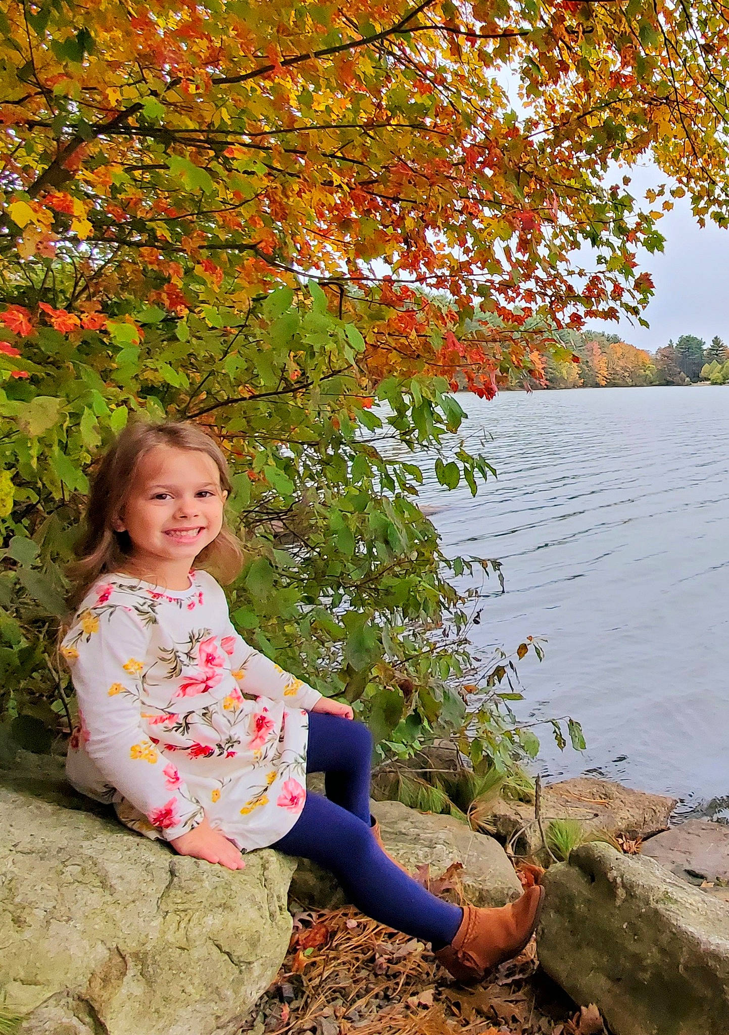 Preslee is registered to the contest to win money with this photo: autumn, bank, branch, child, deciduous, fawn, joy, leaf, people_in_nature, person, photography, plant, sitting, spring, toddler, tree