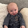 baby, child, clothing, comfort, couch, cushion, cute, face, hand, happy, indoors, infant, person, portrait, sitting, smile, soft, striped, teddy_bear, young