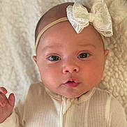 Poet joined the competition — help win amazing prizes! baby, infant, face, headband, bow, eyes, expression, clothing, blanket, texture, portrait, cute, child, newborn, soft, skin, hand, laying, indoors, closeup