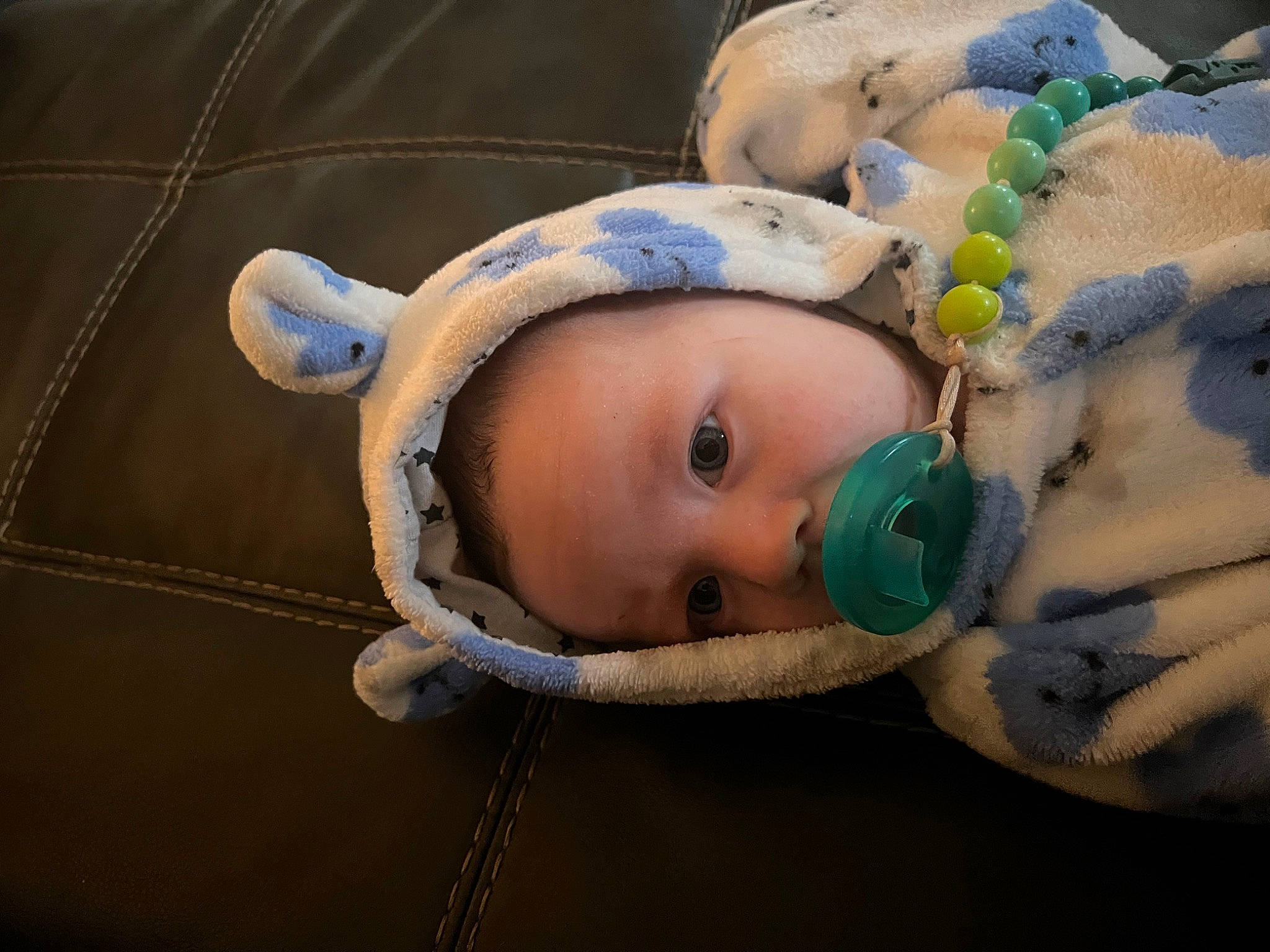 Wyatt is registered to the contest to win money with this photo: baby, baby_products, baby_safety, baby_toys, cheek, child, comfort, eye, eyelash, infant_bed, linens, person, plush, room, skin, stuffed_toy, toddler, wood