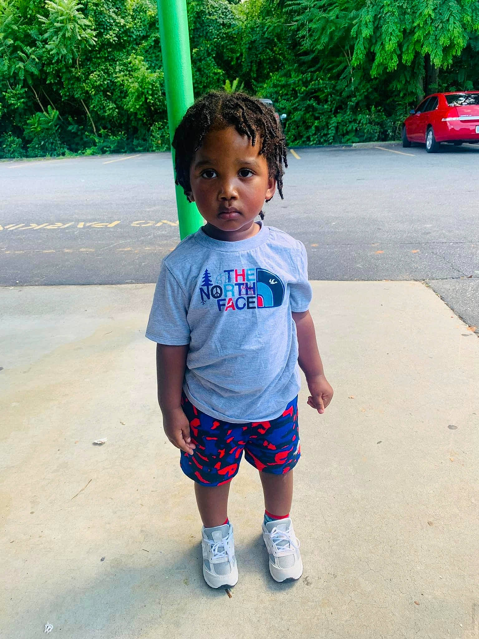 Jaceon is registered to the contest to win money with this photo: asphalt, electric_blue, eye, fun, grass, green, happy, human_body, leg, leisure, person, plant, recreation, red, shoulder, sleeve, t_shirt, toddler, travel, tree