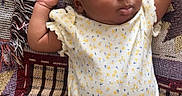 Atlantis is registered to the contest to win money with this photo: adorable, baby, blanket, child, clothing, cute, footwear, hands_up, headband, indoors, infant, onesie, pattern, peaceful, portrait, resting, sleep, sleeping, soft, toddler