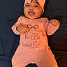 Winta joined the competition — help win amazing prizes! baby, infant, smiling, headband, bow, peach, outfit, clothing, lying_down, happy, child, cute, portrait, indoors, person, text_on_clothing, fabric, hands, feet, face