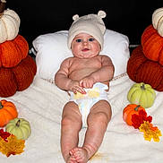 Liam joined the competition — help win amazing prizes! baby, infant, diaper, knit_hat, blanket, pumpkin, knitted_pumpkin, autumn_leaves, fall, cute, chubby, blue_eyes, smiling, lying_down, cozy, soft_texture, child, seasonal, holiday, cute_hat