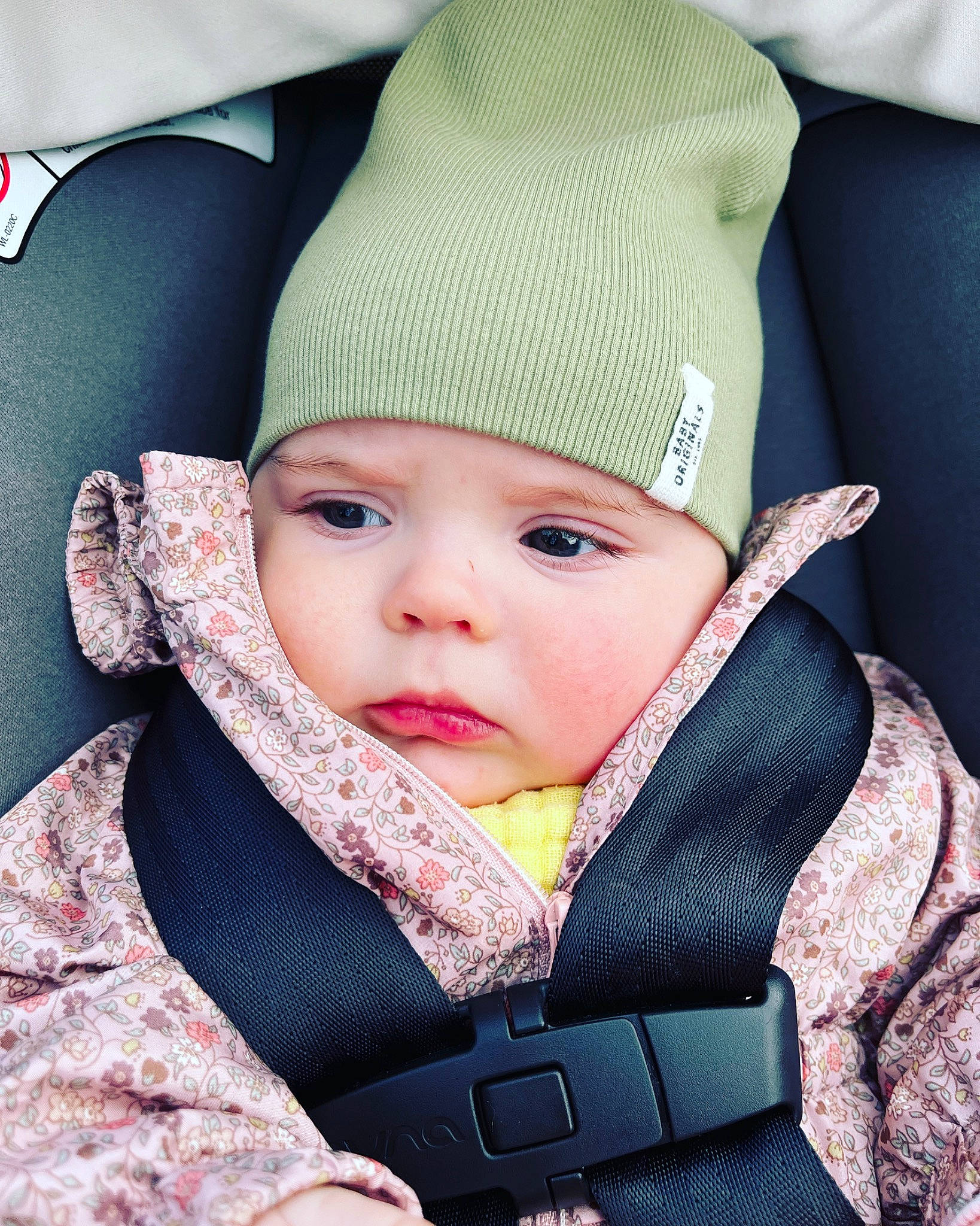 Kristina is registered to the contest to win money with this photo: baby, baby_carriage, baby_products, baby_safety, baby_sleeping, baby_toddler_clothing, cap, cheek, child, collar, comfort, face, fashion_accessory, headwear, knit_cap, outerwear, person, product, sitting, skin