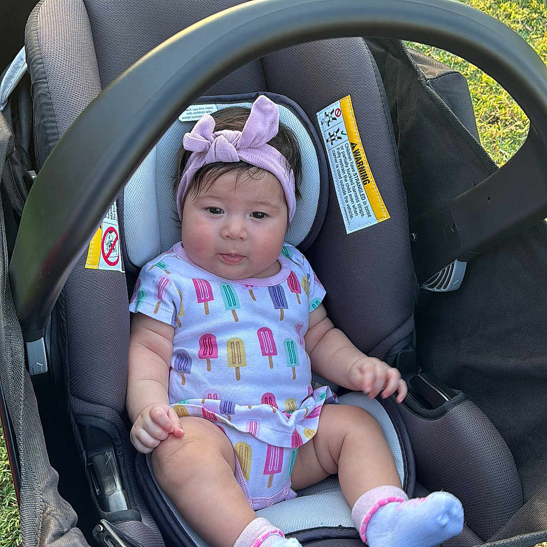 Bealhy is registered to the contest to win money with this photo: baby, child, colorful, cute, fabric, grass, happy, headband, infant, onesie, outdoor, park, playful, popsicle_pattern, seat, socks, stroller, summer, sunlight, tongue