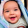 baby, smiling, blanket, indoor, cute, child, happy, face, portrait, infant, warm, soft, cozy, toddler, clothing, closeup, expression, head, skin, cheerful