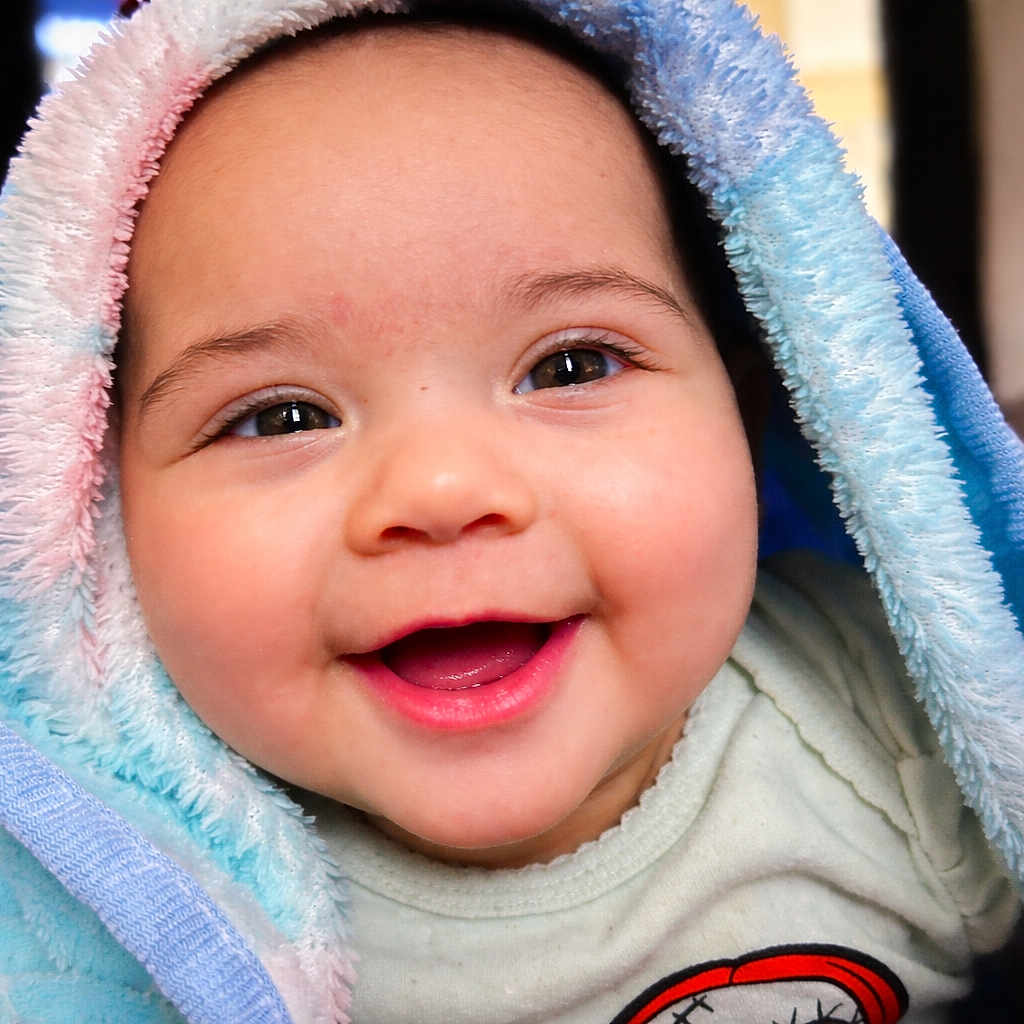 Winter joined the competition — help win amazing prizes! baby, smiling, blanket, indoor, cute, child, happy, face, portrait, infant, warm, soft, cozy, toddler, clothing, closeup, expression, head, skin, cheerful