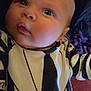Arthur participe au concours pour gagner de l'argent avec cette photo : baby, infant, face, eyes, clothing, black_and_white, striped, person, closeup, portrait, cute, child, young, indoors, expression, wearing, sleeves, head, skin, looking_up
