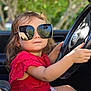 élora participe au concours pour gagner de l'argent avec cette photo : car, casual, child, cute, driving, fashion, hands, nature, outdoor, person, portrait, red_clothing, reflection, seat, steering_wheel, summer, sunglasses, toddler, window, young