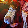 baby, infant, sleeping, blanket, onesie, dinosaur_print, feet, toes, cozy, red, black, fabric, indoors, rest, child, cute, soft, peaceful, nap, person
