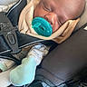 baby, pacifier, sleeping, car_seat, child, infant, clothing, blanket, seatbelt, car_interior, cute, hood, comfort, young_child, resting, toddler, fabric, safety, closeup, peaceful