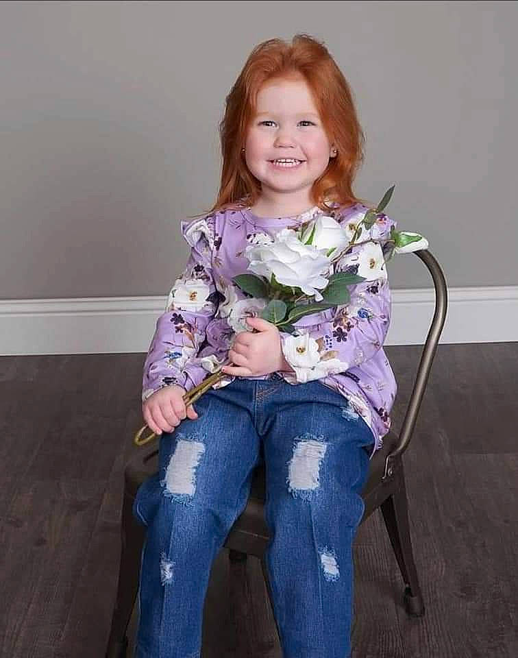 Ariel joined the competition — help win amazing prizes! baby_toddler_clothing, chair, comfort, denim, flower, hair, happy, head, jeans, joy, knee, leg, long_hair, person, purple, shoe, sitting, skin, sleeve, smile