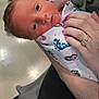 Theo joined the competition — help win amazing prizes! newborn, baby, infant, hospital, blanket, person, hand, ring, nail_polish, medical_equipment, floor, shoe, clothing, cradle, skin, portrait, indoor, care, holding, closeup